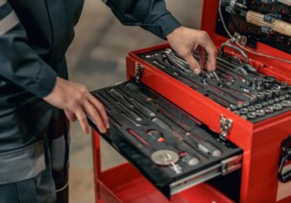 male-mechanic-using-tool-box-in-hangar.jpg